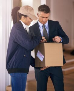 legal courier A doctor signing a tablet and receiving a medical delivery from an RTD Logistics courier